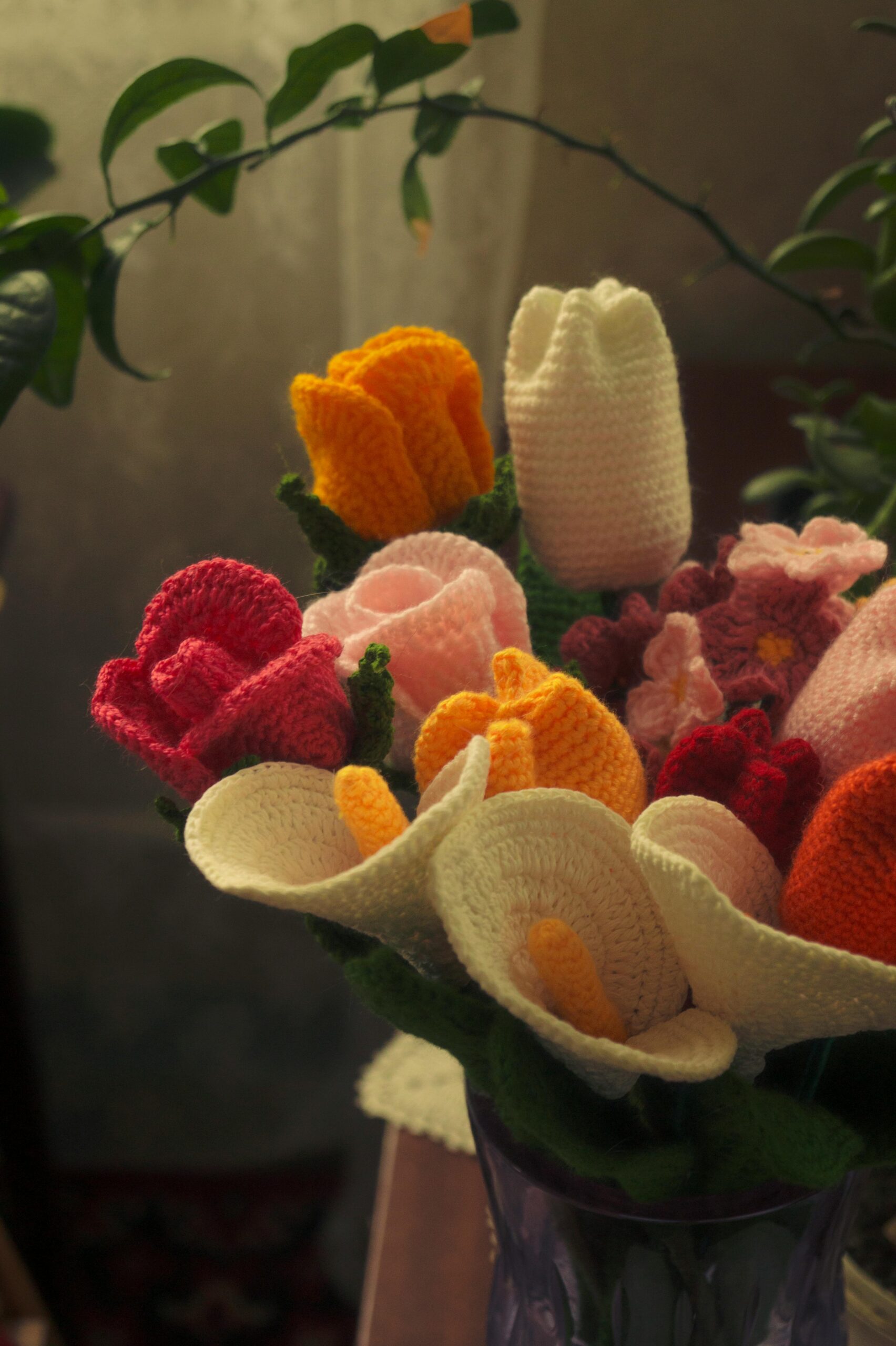 pexels photo 20269075 20269075 A vibrant bouquet of crocheted flowers in various colors, arranged in a vase.