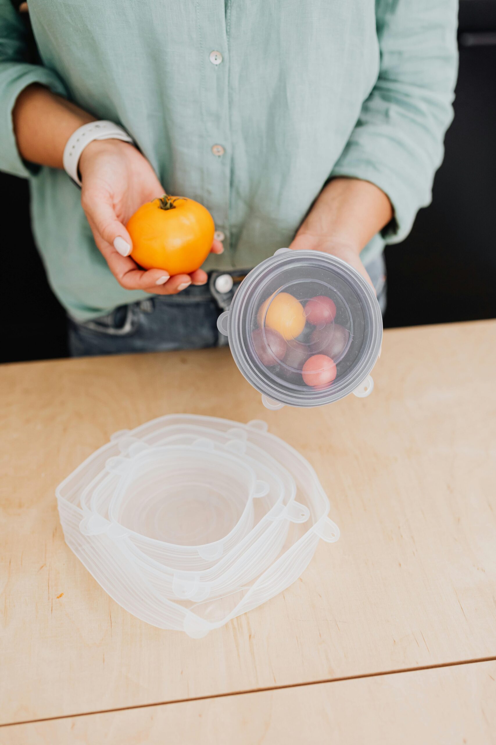 pexels photo 5237825 5237825 Person holding fresh vegetables and using eco-friendly storage in kitchen.