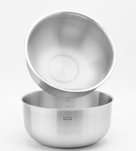 About Stainless steel mixing bowl with a strainer, perfect for kitchen use and food preparation.